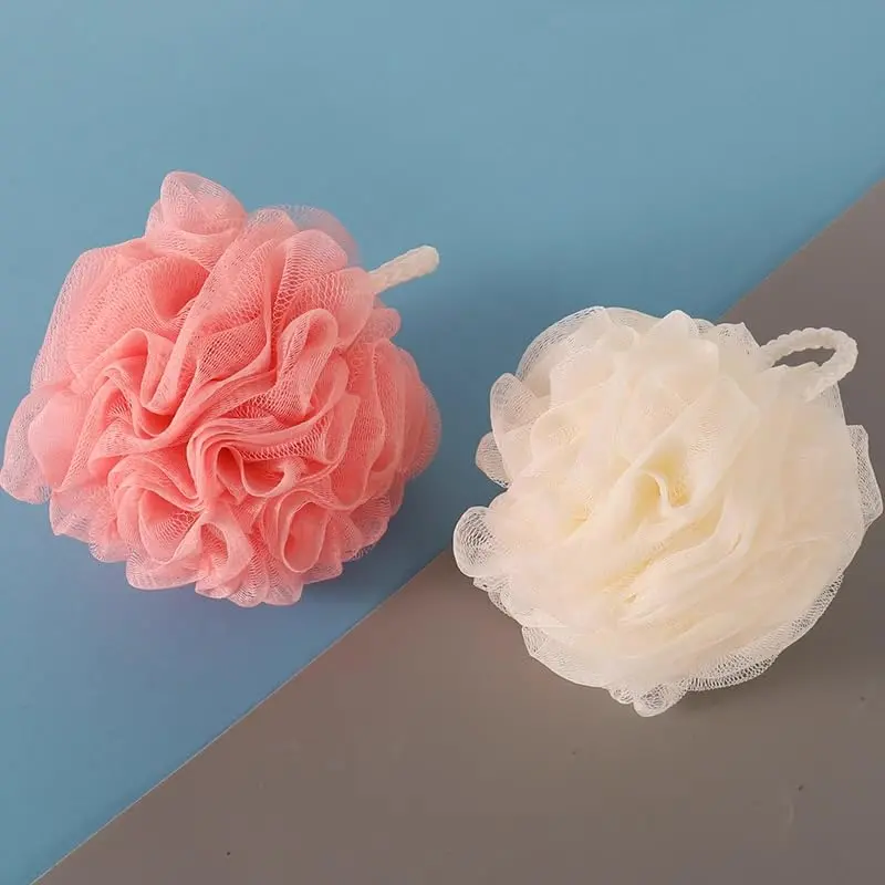 This 2-pack of soft, large, and fluffy bath balls gently exfoliates and creates a rich lather for a luxurious shower experience, perfect for daily cleansing.