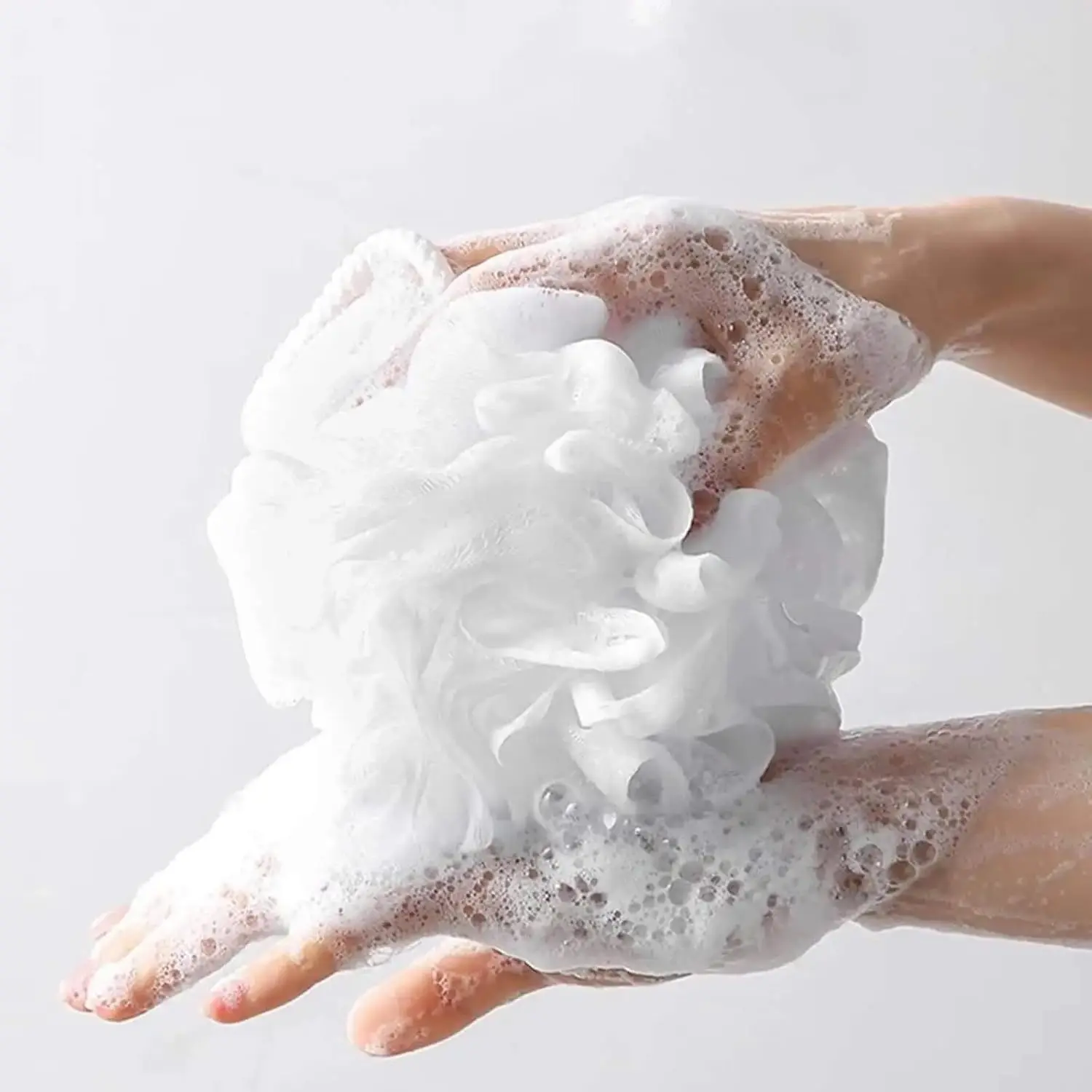 This 2-pack of soft, large, and fluffy bath balls gently exfoliates and creates a rich lather for a luxurious shower experience, perfect for daily cleansing.