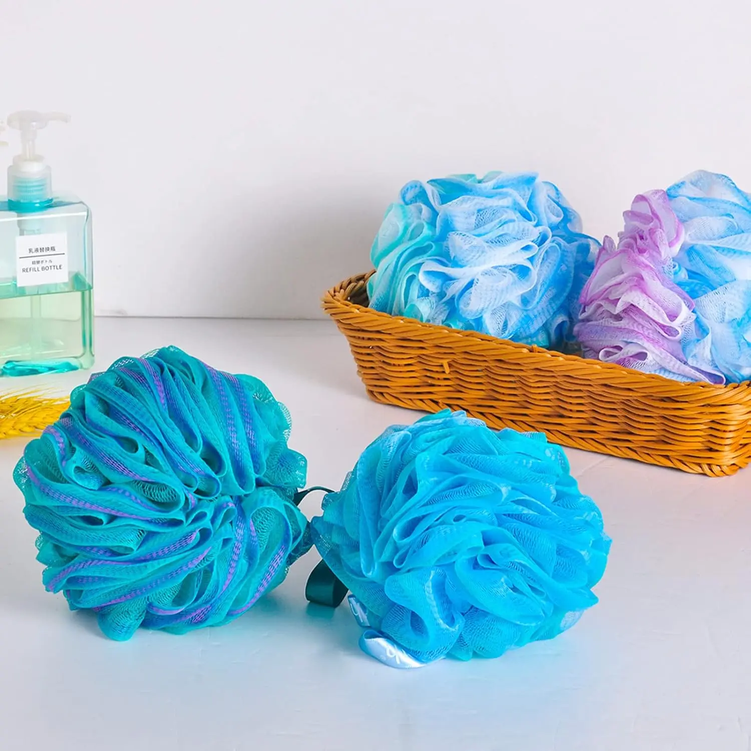 This set includes four colorful bath shower sponges designed with strong knotting for durability, creating a rich lather and gently exfoliating the skin.