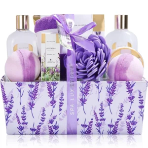 This premium lavender bath spa gift basket for women includes soap, massage oil, bath bombs, dry hair cap, bath puff, and body lotion for a relaxing home spa experience.
