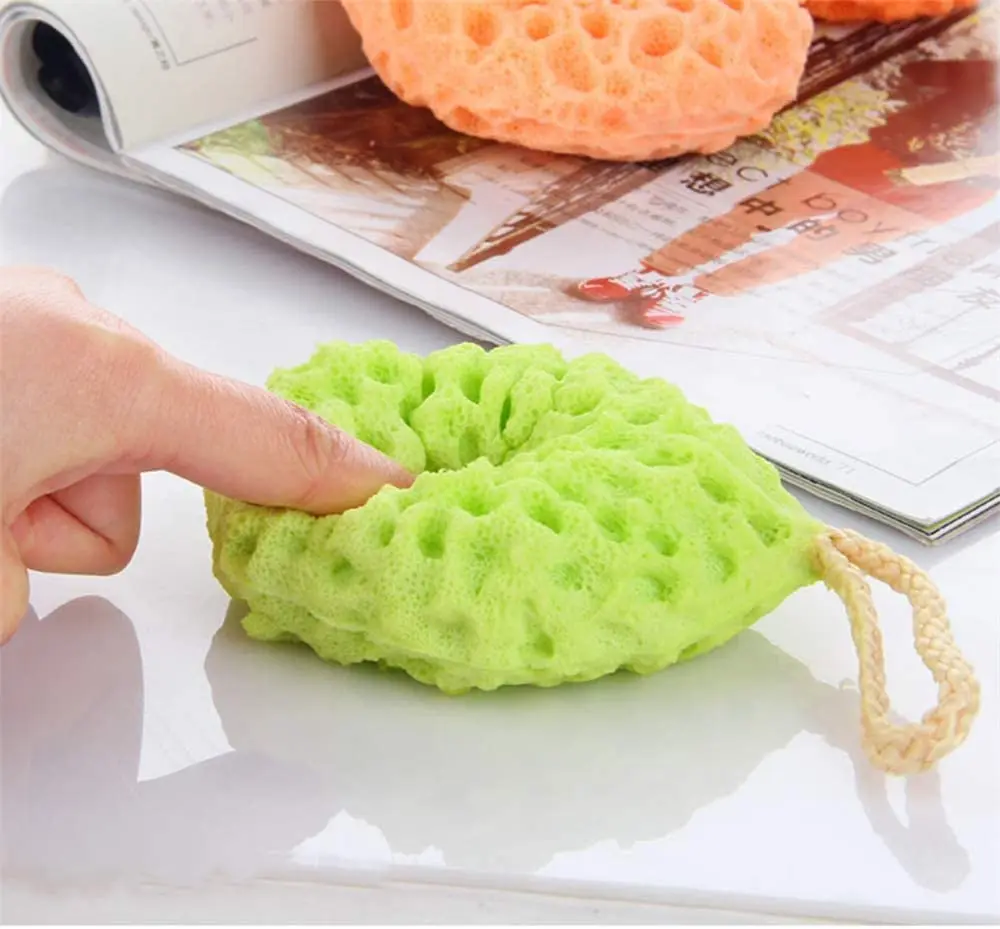 This three-pack of soft body bath sponges includes yellow, green, and orange natural fiber shower loofahs with a unique honeycomb texture for gentle exfoliating and cleansing.
