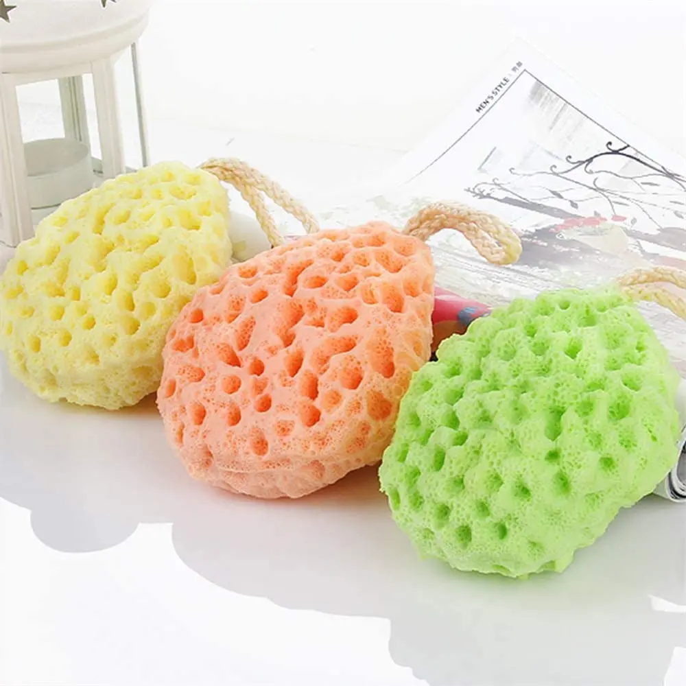 This three-pack of soft body bath sponges includes yellow, green, and orange natural fiber shower loofahs with a unique honeycomb texture for gentle exfoliating and cleansing.