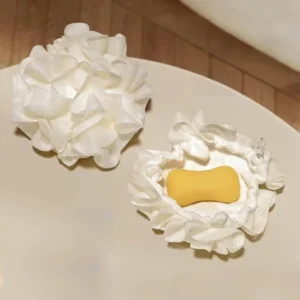 Two colorful bath sponges, or shower loofahs, designed for exfoliating and washing, and capable of holding soap inside, suitable for men and women.