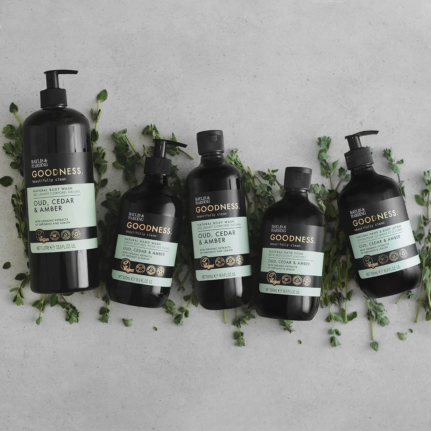 A bottle of Baylis & Harding Goodness body wash featuring a luxurious fragrance fusion of Oud, Cedar and Amber, providing a refreshing and nourishing cleanse suitable for vegans.