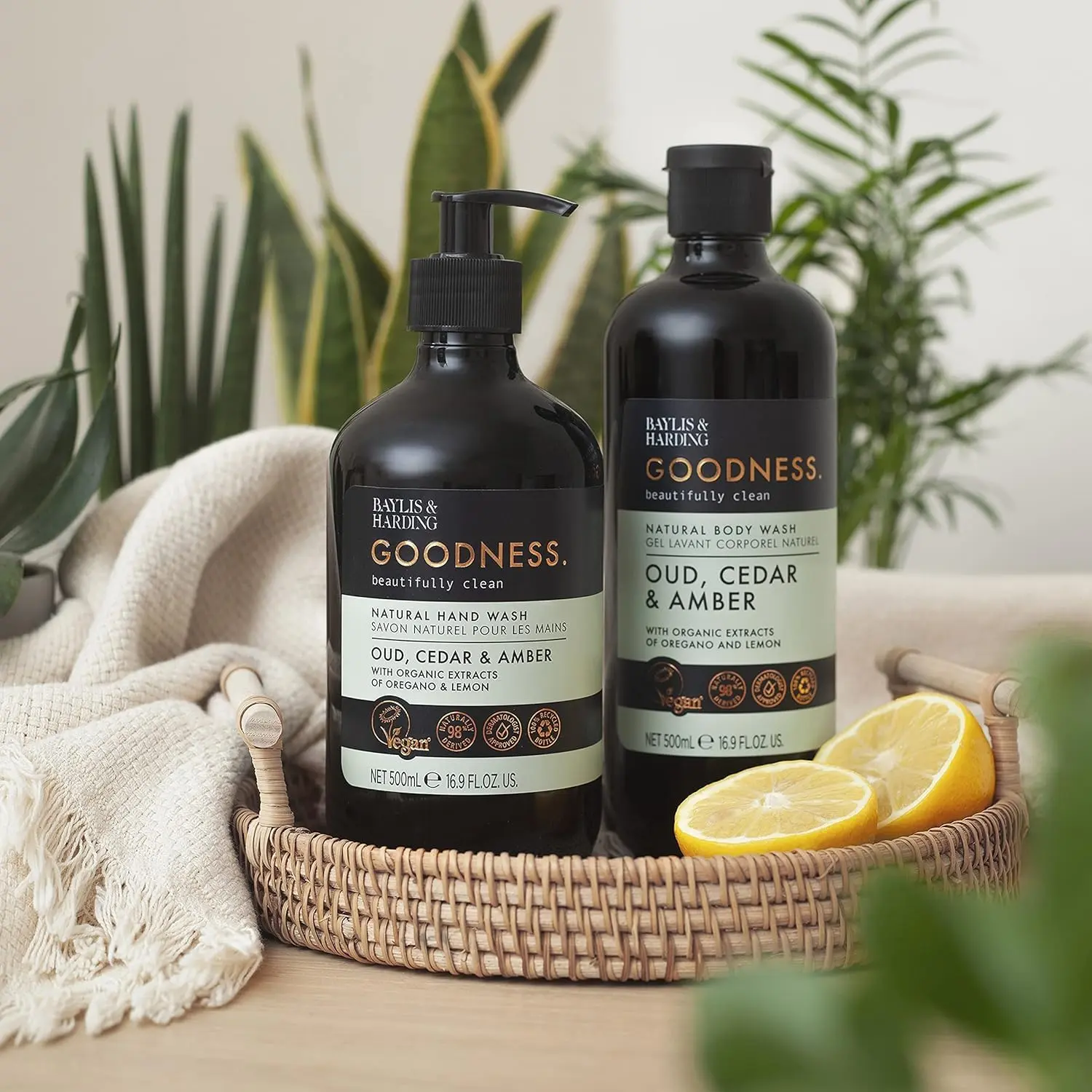 A bottle of Baylis & Harding Goodness body wash featuring a luxurious fragrance fusion of Oud, Cedar and Amber, providing a refreshing and nourishing cleanse suitable for vegans.