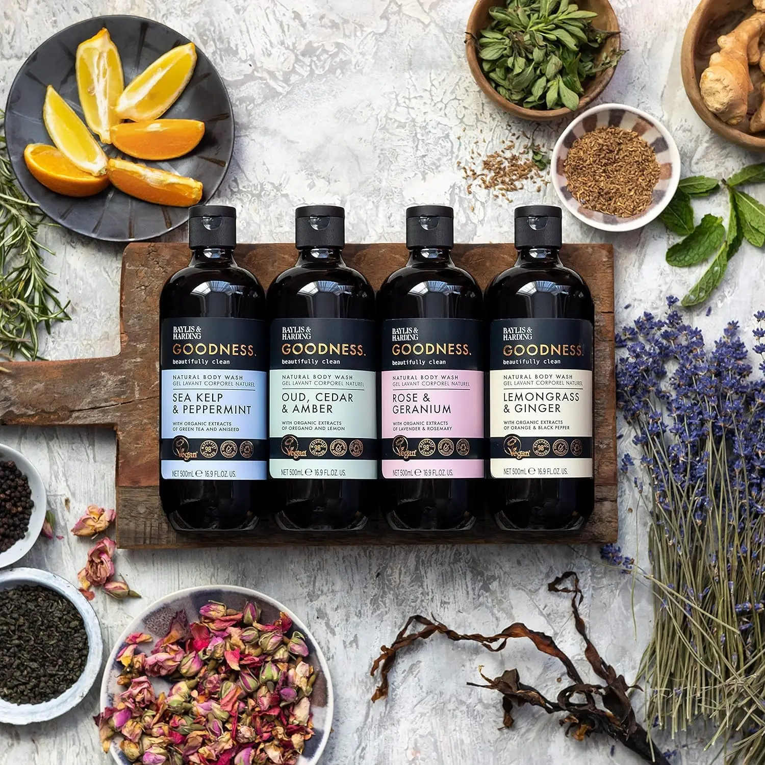 A bottle of Baylis & Harding Goodness body wash featuring a luxurious fragrance fusion of Oud, Cedar and Amber, providing a refreshing and nourishing cleanse suitable for vegans.