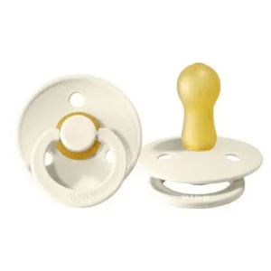 An ivory Bibs Colour natural rubber latex pacifier for babies 0-6 months, featuring a round, symmetrical nipple and a safe food-grade shield, designed and made in Denmark.
