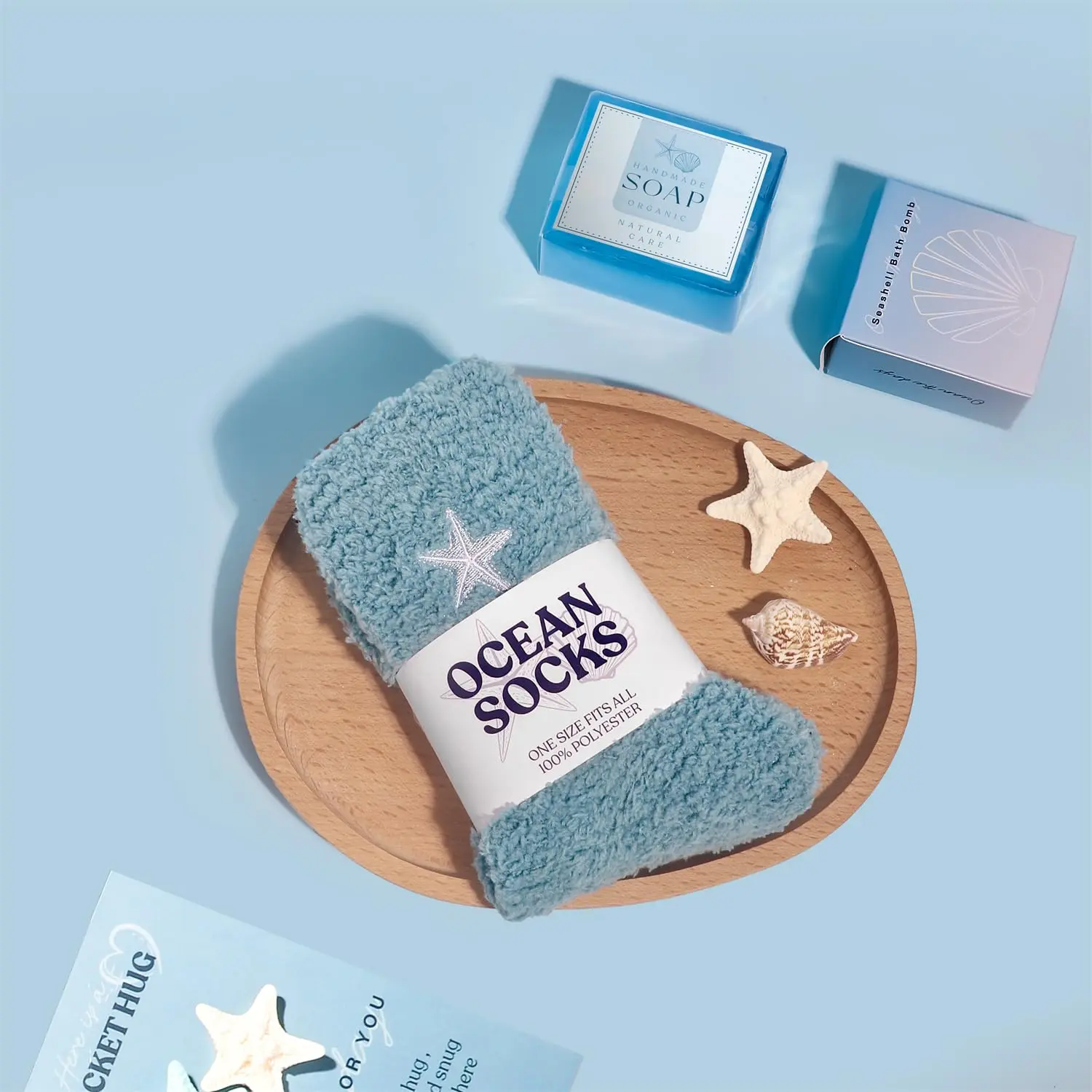 This blue ocean themed spa gift set for women includes a candle, blanket, tumbler, and bath products, perfect for birthdays and self-care.