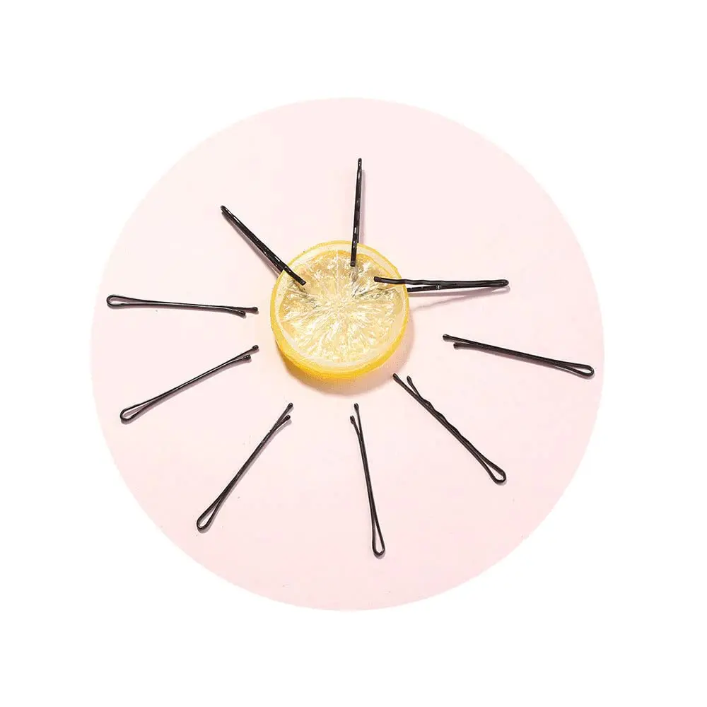 This set features 200 durable black bobby pins in a cute storage box, perfect for creating various hairstyles for women and girls with all hair types.