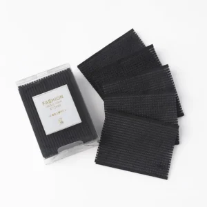 A set of ten black hair styling clips with square pads for a secure, non-slip grip, ideal for sectioning hair during styling, makeup application, and facial treatments.