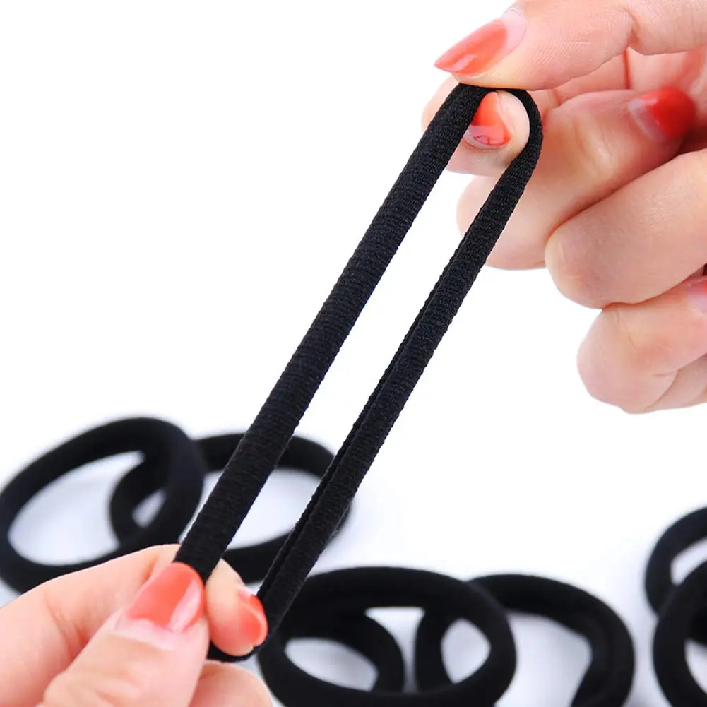 A bulk pack of 100 black seamless hair ties perfect for thick, curly, straight, or thin hair, suitable for toddlers, girls, and kids.