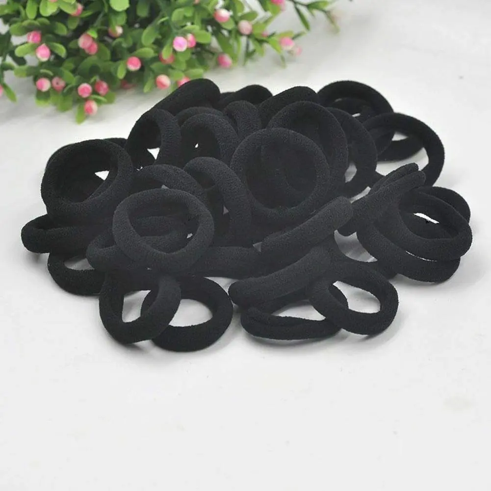 A bulk pack of 100 black seamless hair ties perfect for thick, curly, straight, or thin hair, suitable for toddlers, girls, and kids.
