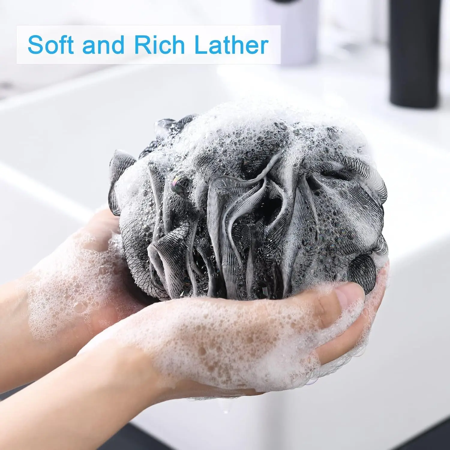 A black exfoliating loofah sponge for use as a body scrubber in the bath or shower.