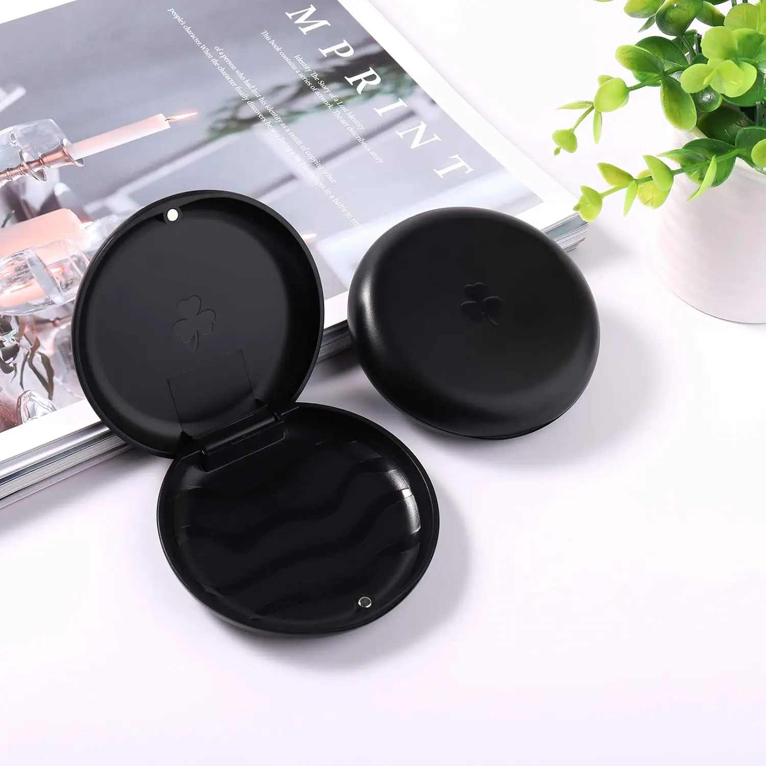 This 5 pack of black orthodontic retainer cases provides a secure and portable storage solution for retainers and mouthguards.