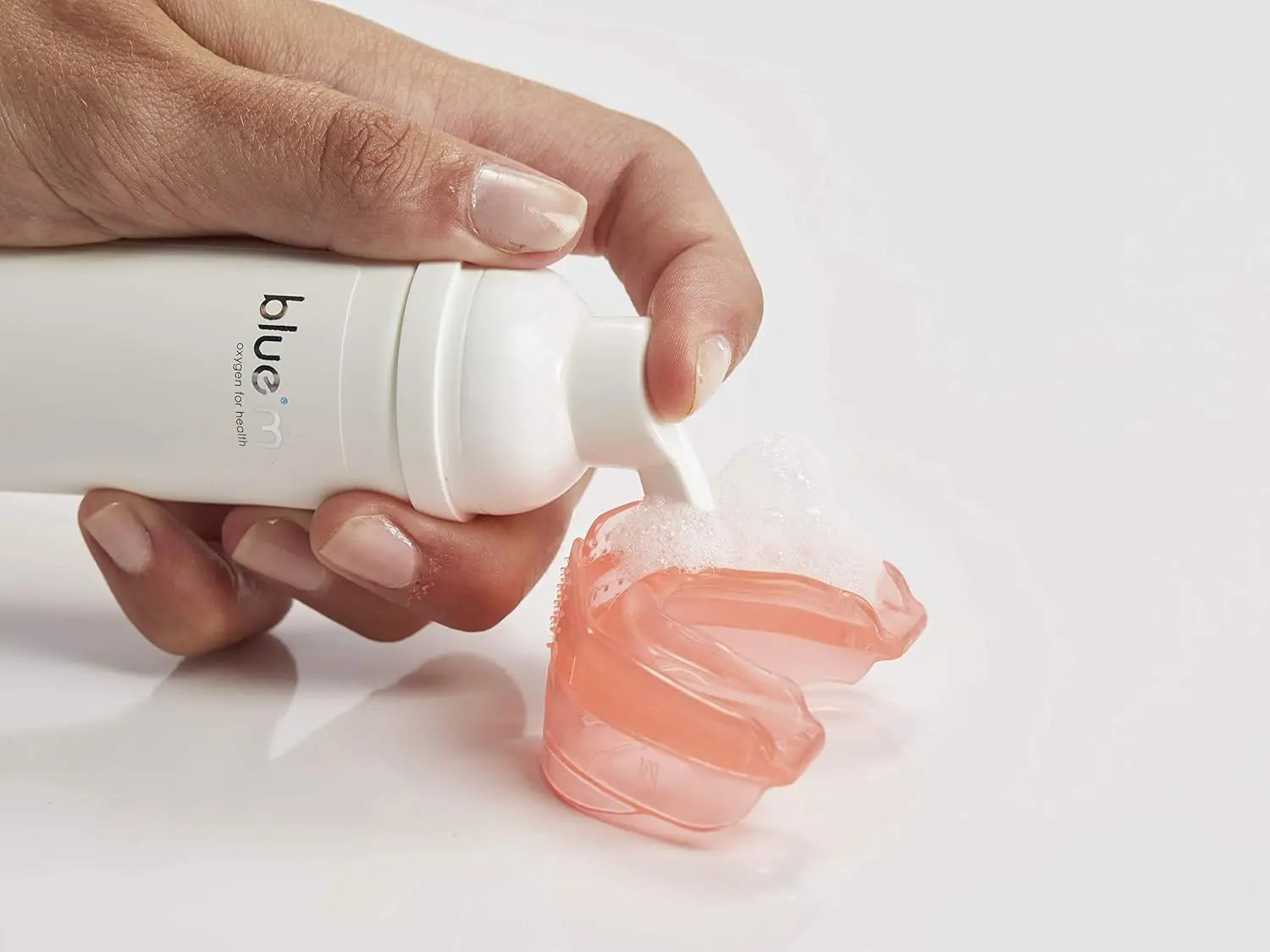 BlueM oral foam retainer cleaner in its packaging, a great gift option and with long-lasting durability.