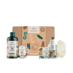 The Body Shop Shea Gift Set includes Shea Shower Cream, Body Butter, Hand Balm, Soap, and a Ramie Bath Flower for cleansing, nourishing, and pampering dry skin.