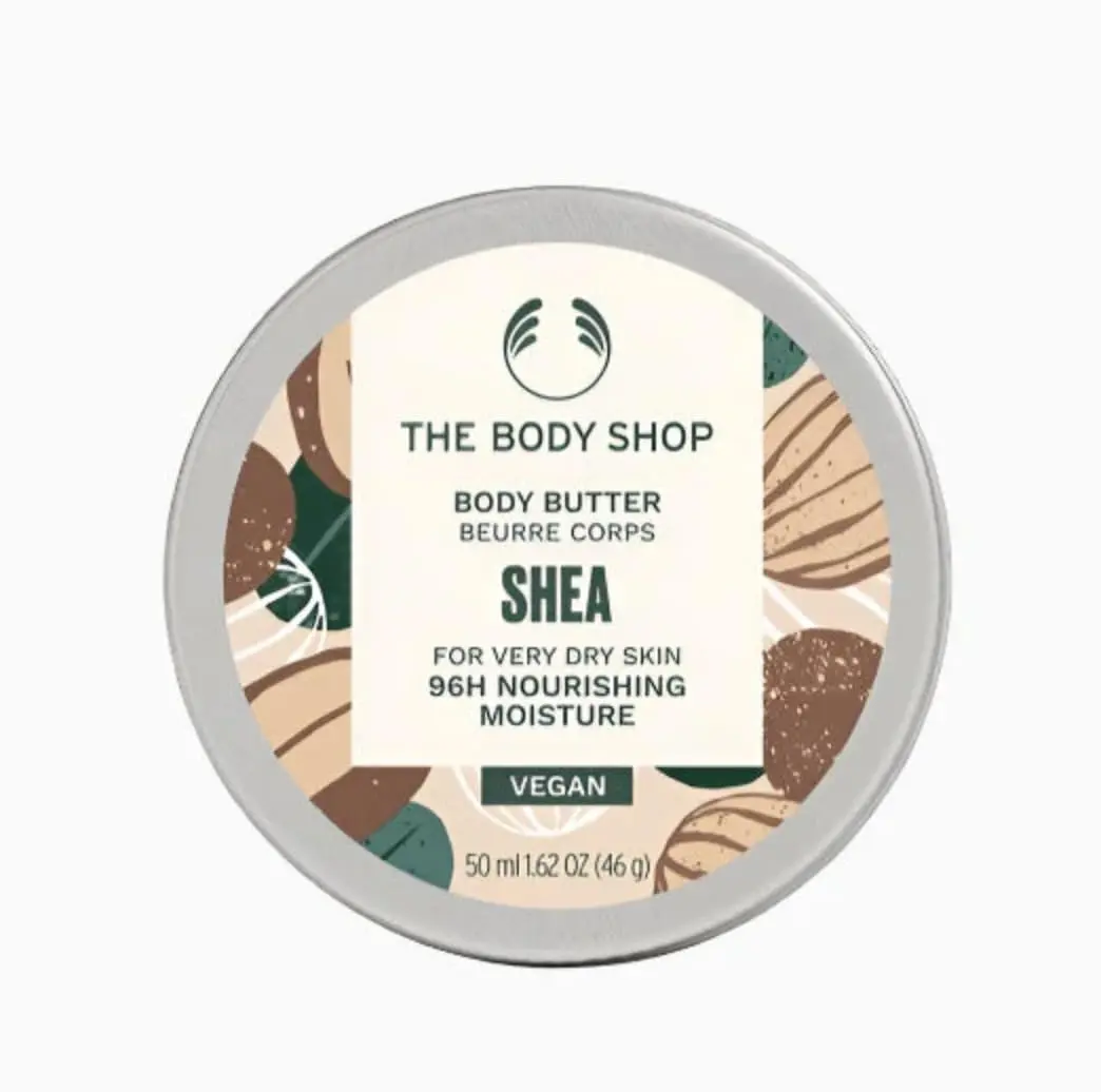 The Body Shop Shea Gift Set includes Shea Shower Cream, Body Butter, Hand Balm, Soap, and a Ramie Bath Flower for cleansing, nourishing, and pampering dry skin.