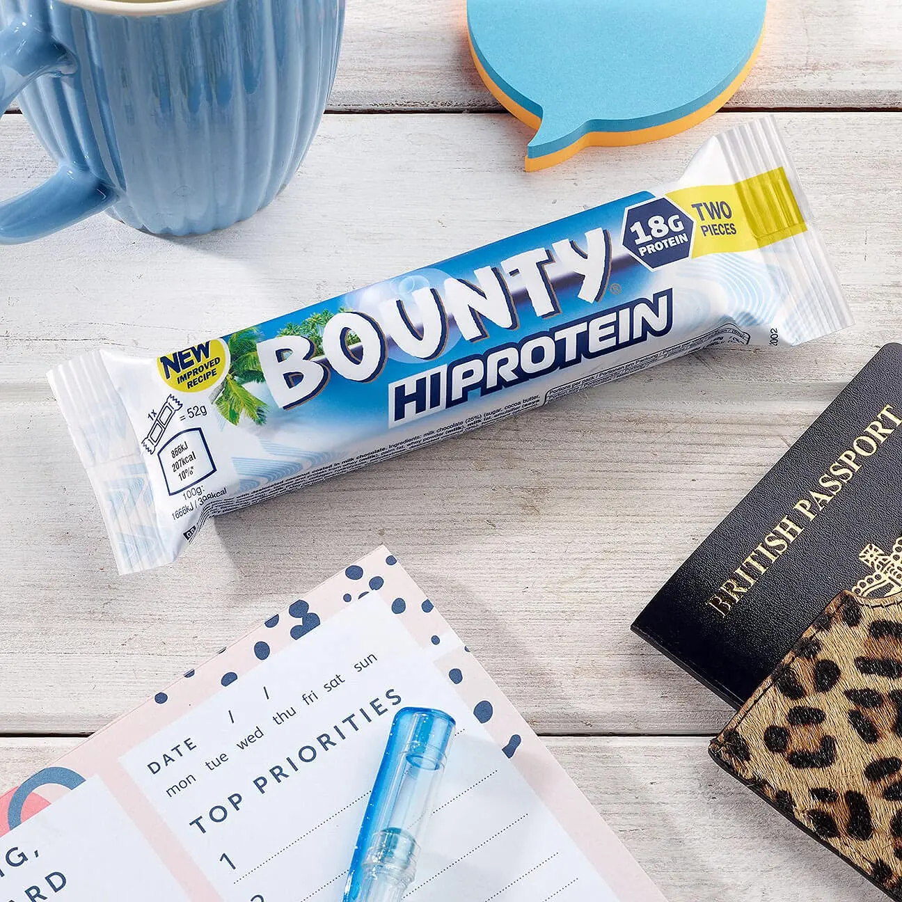 A delicious Bounty Hi Protein Bar featuring milk chocolate and coconut, providing a high-protein energy snack with 18g of protein.