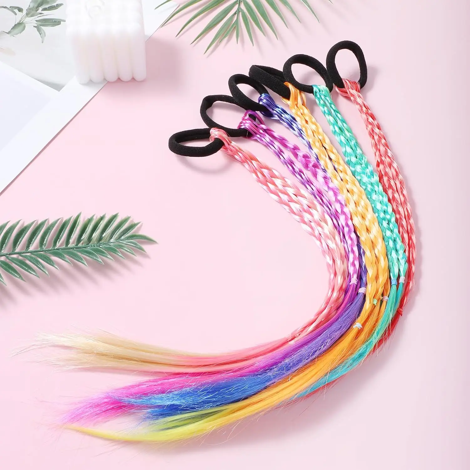 This image shows a pack of six colorful braided hair extensions with elastic bands, perfect for adding a pop of color to hairstyles for girls and women at parties or for everyday wear.