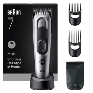 Grey Braun Series 5 HC7590 electric hair clipper with two combs, charging stand and pouch for effortless hair cutting at home.