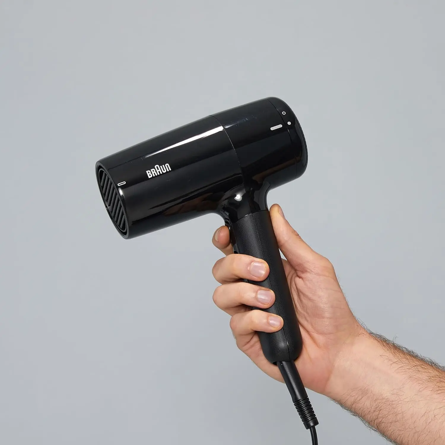 The Braun HD2.2 hair dryer in ion black, featuring 2200 watts of power, IONTEC technology for shine, and three heat modes for fast and customizable drying.