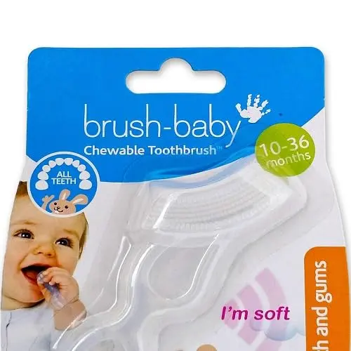 This white Brush-Baby chewable toothbrush and teether, made from medical-grade silicone, soothes sore gums and gently cleans emerging teeth for babies 10 to 36 months old.