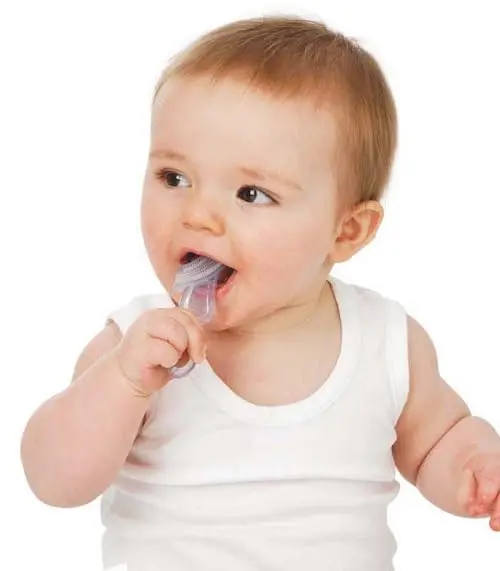 This white Brush-Baby chewable toothbrush and teether, made from medical-grade silicone, soothes sore gums and gently cleans emerging teeth for babies 10 to 36 months old.