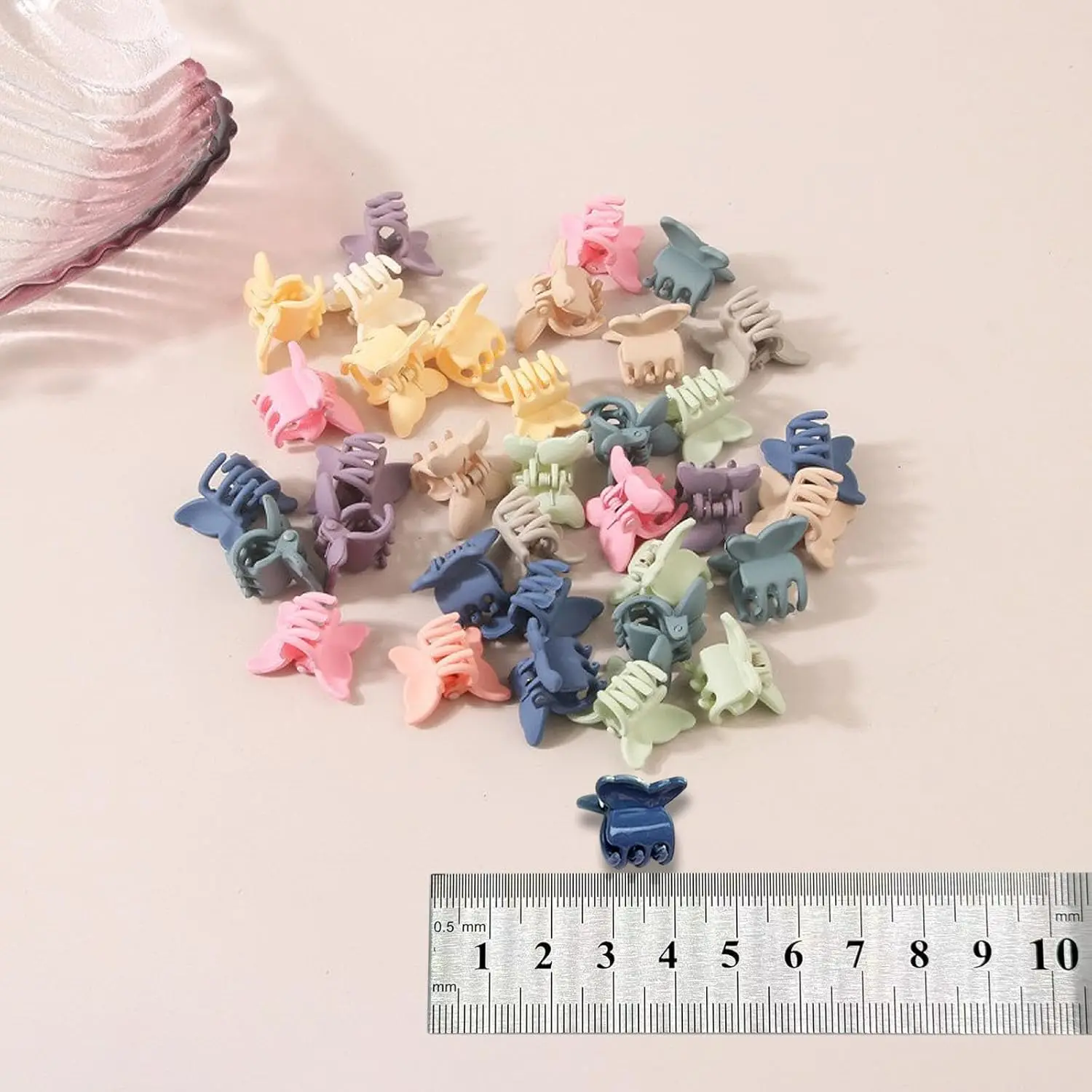 A set of 100 colorful butterfly hair clips perfect for styling baby girls', toddlers', and kids' hair, adding a fun and decorative touch for everyday wear or party styling.