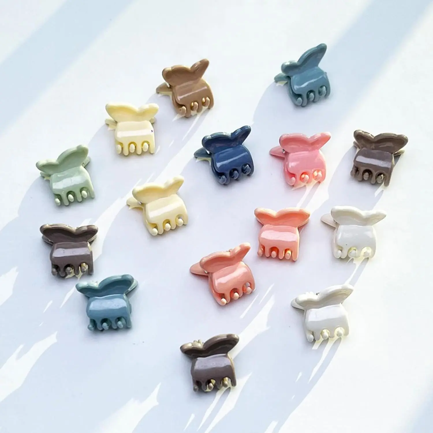 A set of 100 colorful butterfly hair clips perfect for styling baby girls', toddlers', and kids' hair, adding a fun and decorative touch for everyday wear or party styling.