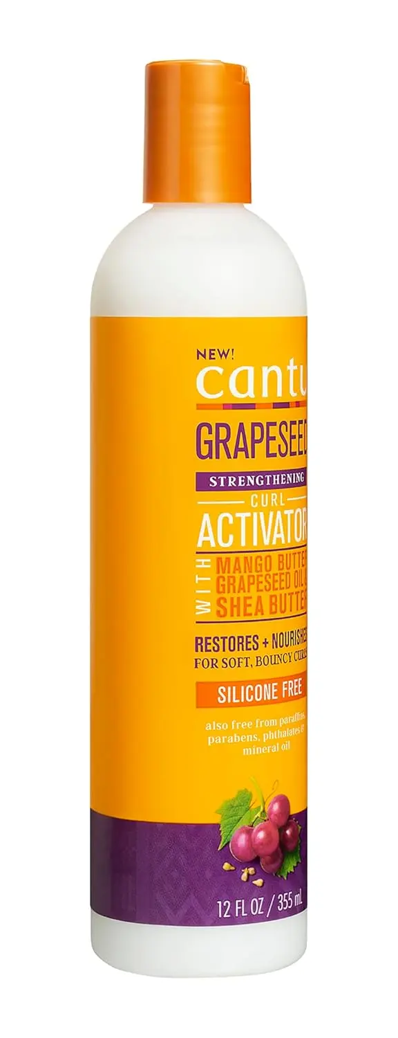 Cantu Grapeseed Curl Activator Cream hydrates and defines curls with shea butter, grapeseed, olive oil, aloe, and mango seed butter, leaving hair soft and moisturized in all climates.