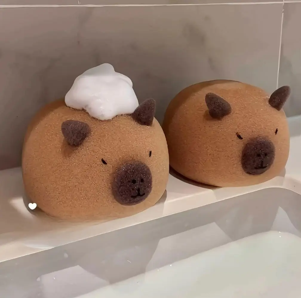 This is a cute capybara bath sponge that exfoliates and foams easily for shower massage in the bathroom.