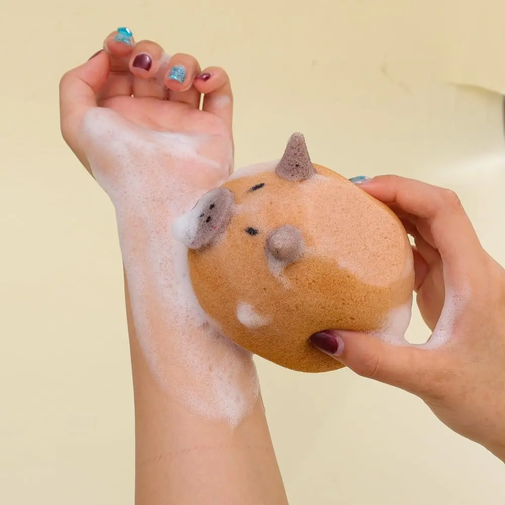 This is a cute capybara bath sponge that exfoliates and foams easily for shower massage in the bathroom.