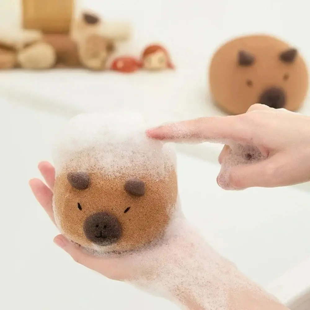 This is a cute capybara bath sponge that exfoliates and foams easily for shower massage in the bathroom.