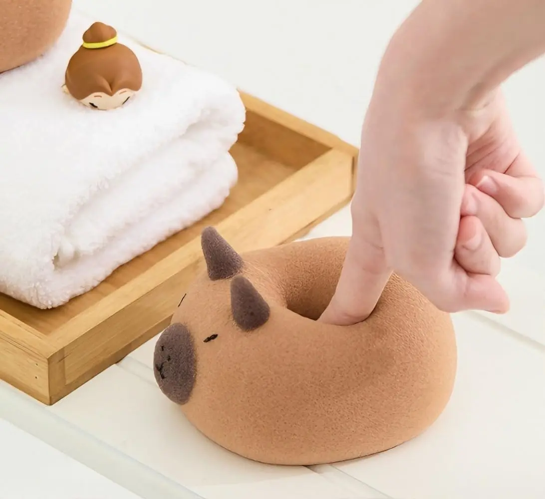 This is a cute capybara bath sponge that exfoliates and foams easily for shower massage in the bathroom.