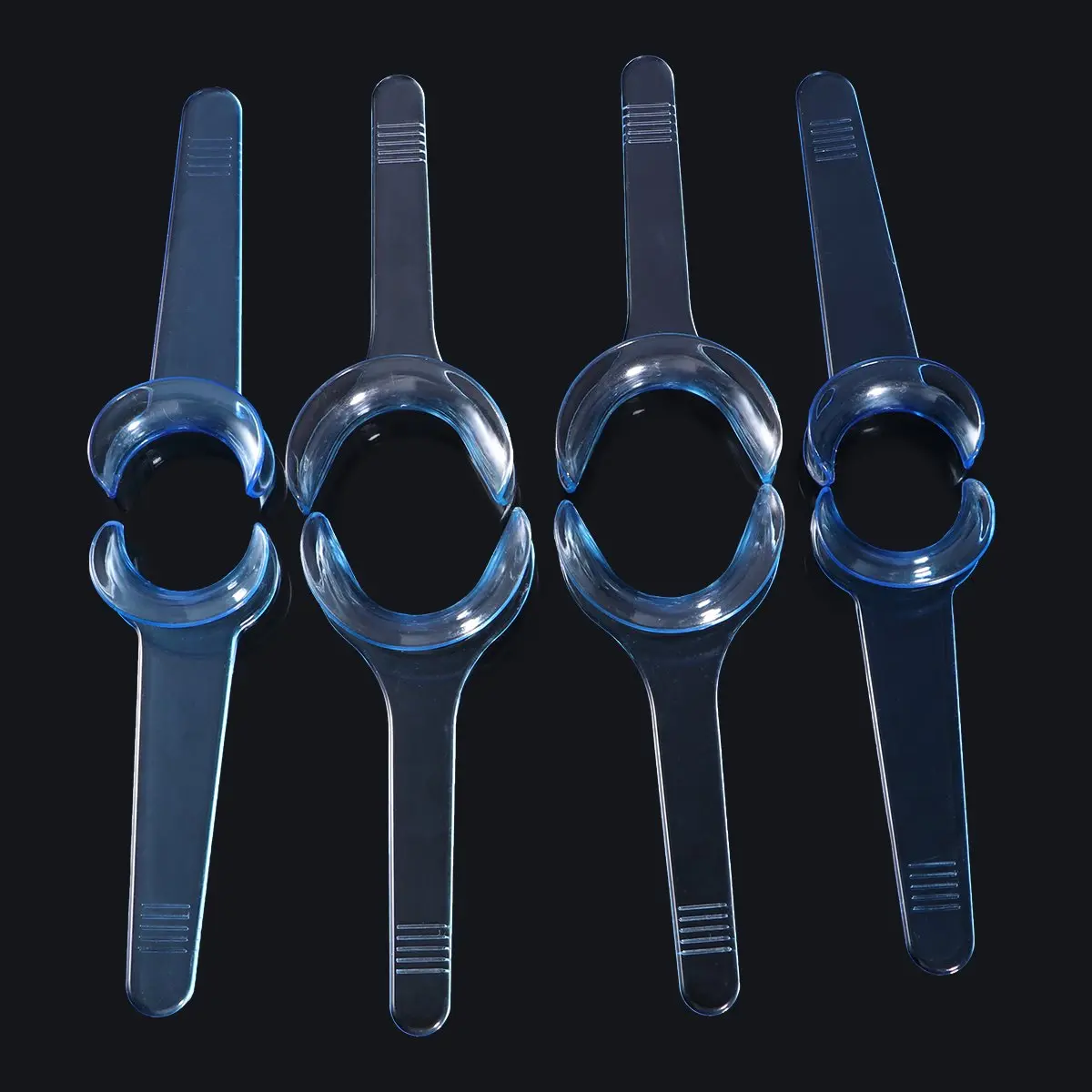 Eight blue T-shaped plastic cheek retractors and mouth openers for clear teeth whitening in dental and orthodontic practices, designed for sterilization and extended use.