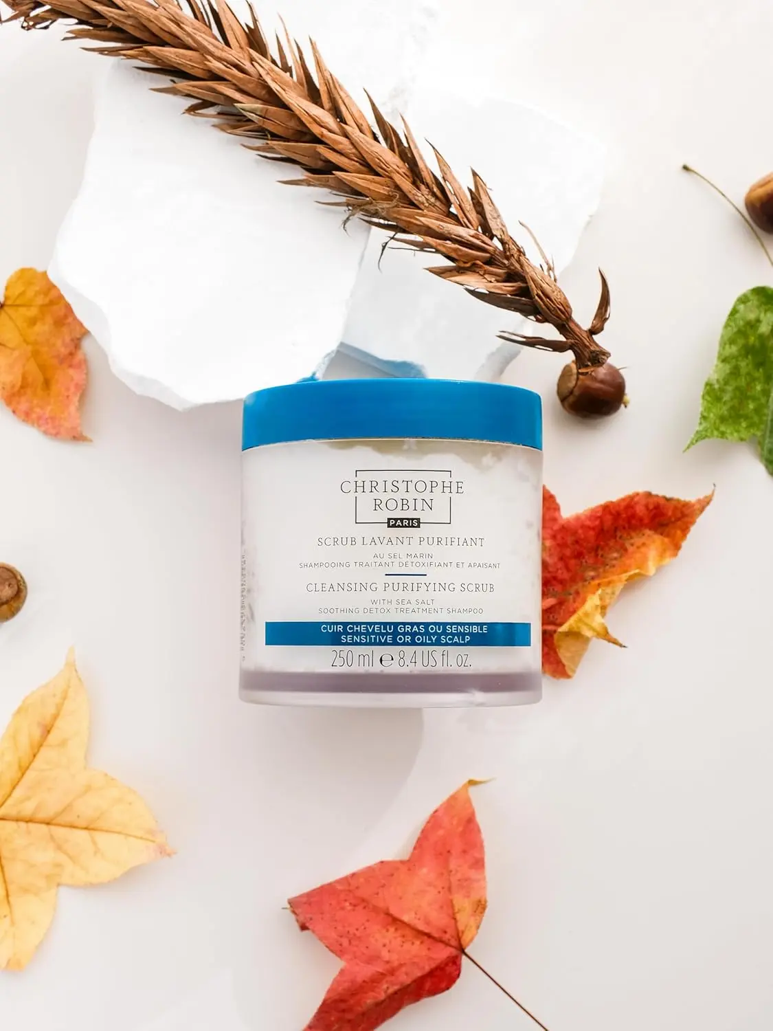 Christophe Robin cleansing purifying scalp scrub with sea salt that soothes itchy and oily scalps, removes buildup, and detoxifies hair.