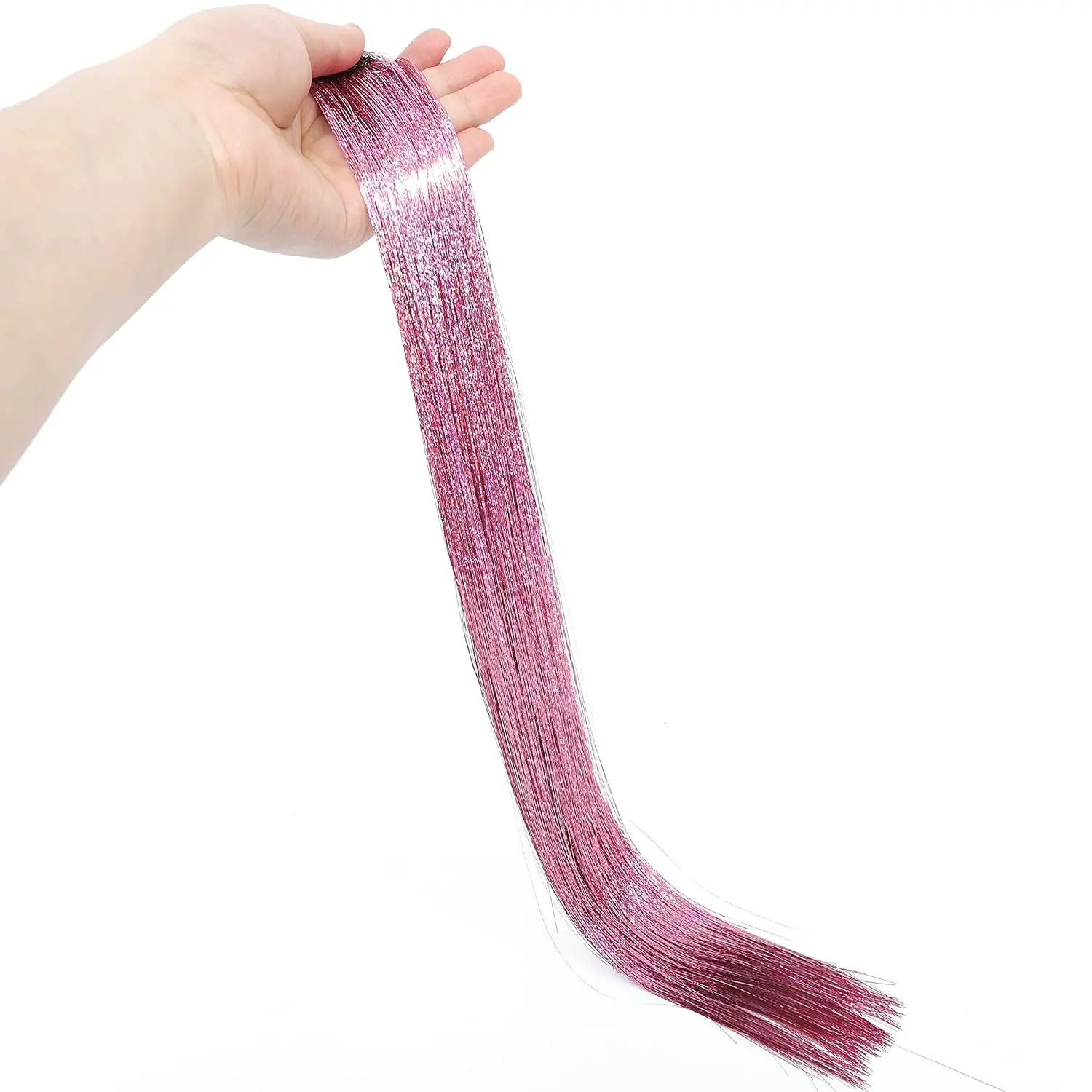 Twelve pink clip in hair extensions made of sparkling tinsel, each 18-19 inches long, provide an instant, temporary highlight.