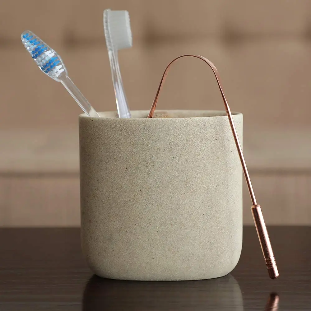 This high-quality copper tongue cleaner with stainless steel comfort grip handles gently removes bacteria and plaque for improved oral hygiene and fresh breath.