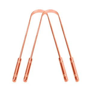 Two copper tongue cleaners made in India with comfortable grip handles for effective bacteria removal and improved oral hygiene.