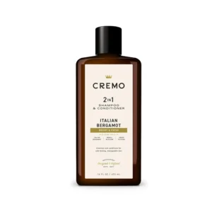 Bottle of Cremo Italian Bergamot 2 in 1 shampoo and conditioner for men, featuring a refreshing scent of neroli blossom and fresh vetiver for all hair types.