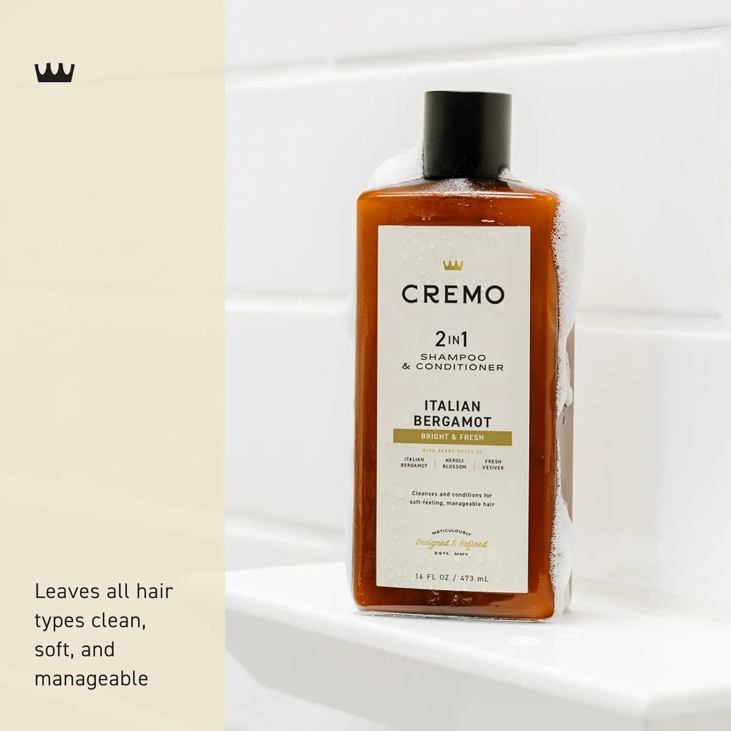 Bottle of Cremo Italian Bergamot 2 in 1 shampoo and conditioner for men, featuring a refreshing scent of neroli blossom and fresh vetiver for all hair types.
