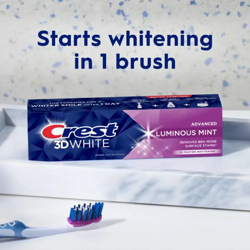 Four tubes of Crest 3D White Advanced Luminous Mint toothpaste for teeth whitening and cavity protection.