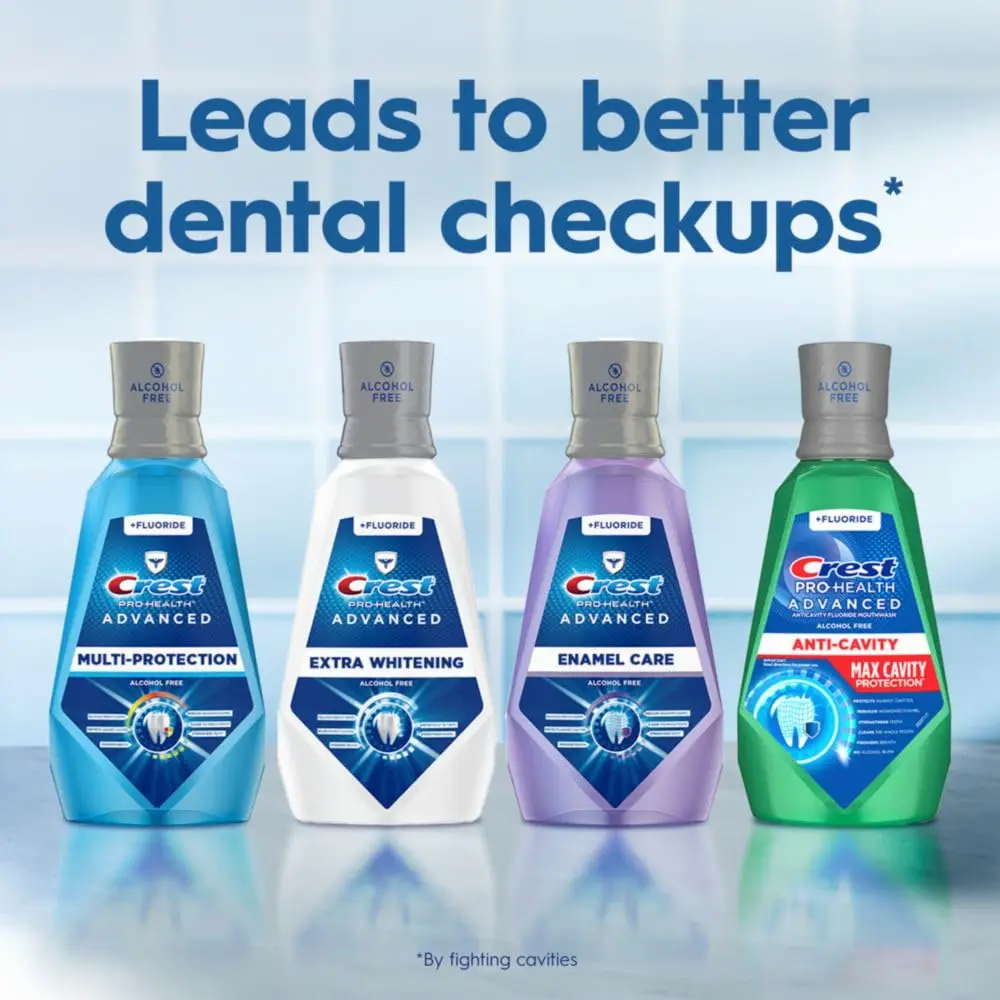 A bottle of Crest Pro-Health Advanced Mouthwash in Energizing Mint flavor, alcohol-free formula that safely whitens teeth by removing surface stains, strengthens enamel, prevents cavities, and kills bad breath germs without the burn.