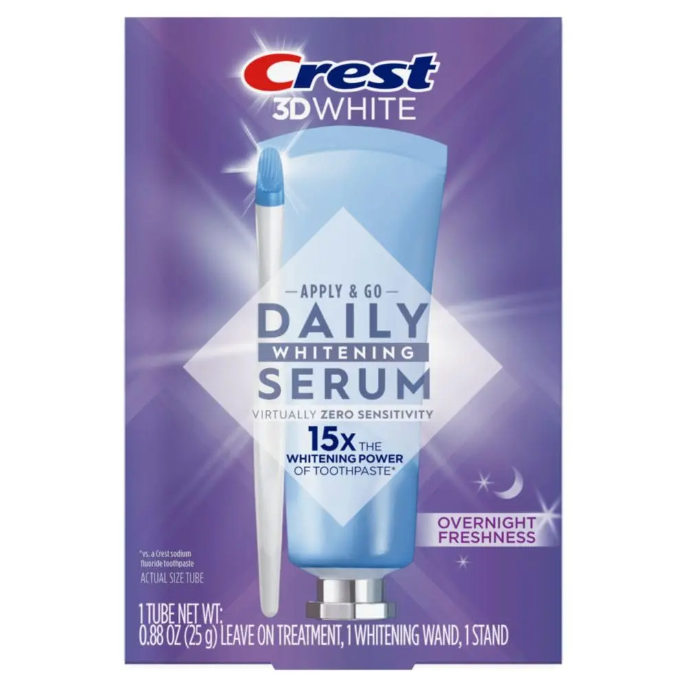 The Crest Whitening Emulsions kit includes a tube of whitening gel, a wand applicator, and a stand for easy storage, designed to whiten teeth and freshen breath while you sleep.