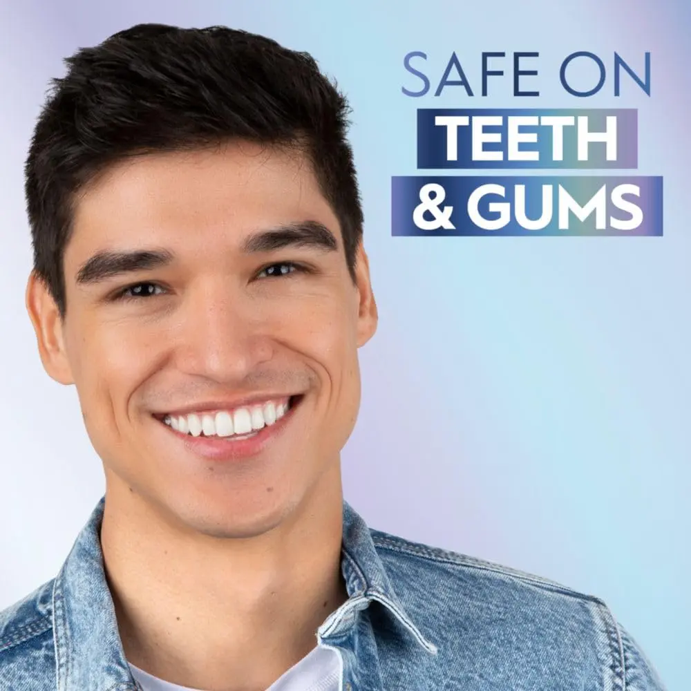 The Crest Whitening Emulsions kit includes a tube of whitening gel, a wand applicator, and a stand for easy storage, designed to whiten teeth and freshen breath while you sleep.