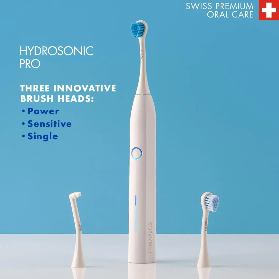 The Curaprox Hydrosonic Pro electric toothbrush provides customized oral care with 7 cleaning levels and comes with multiple brush heads, a travel case, and charging accessories.
