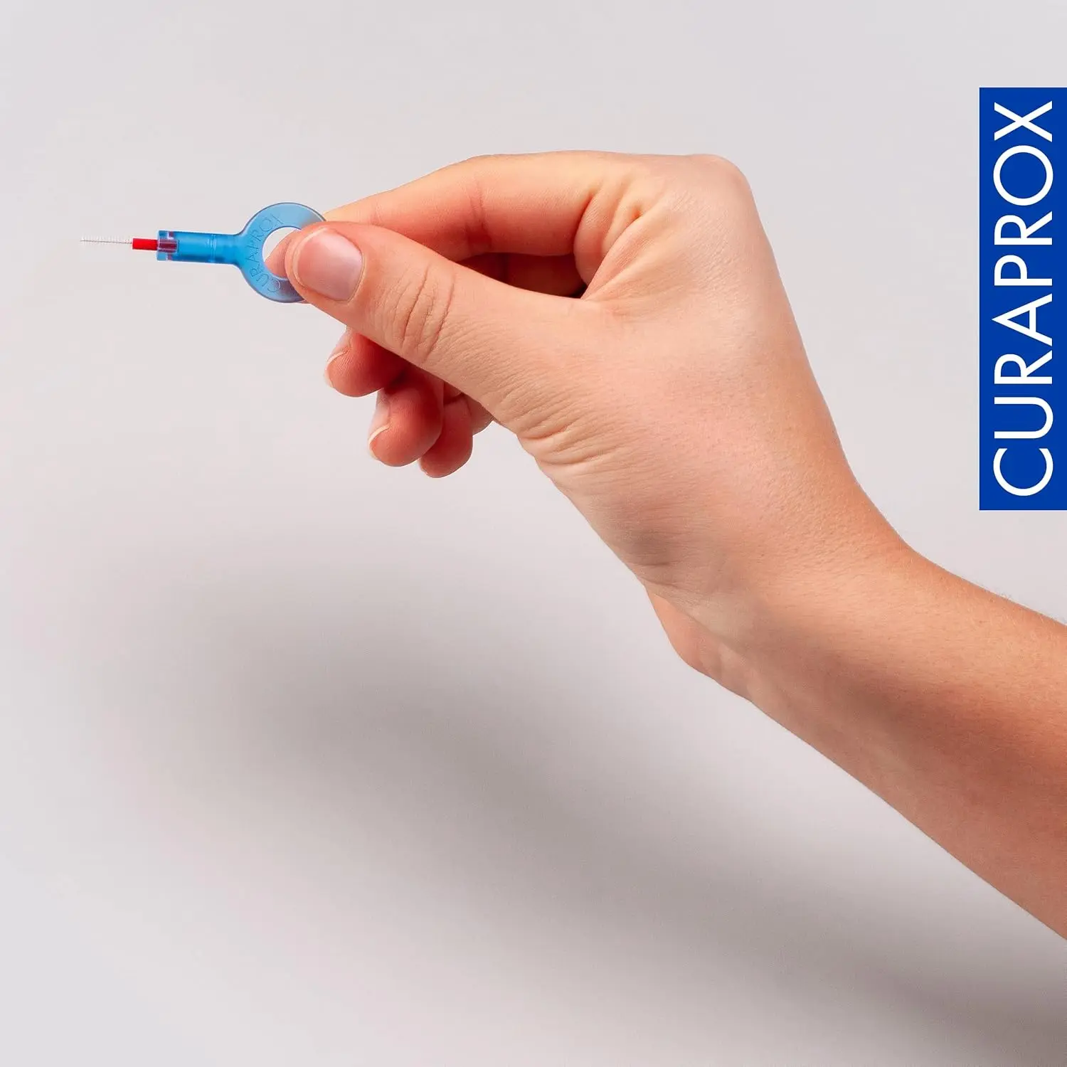 This Curaprox interdental brush kit features five mixed-size brushes and two holders for gentle and effective plaque removal, promoting healthy gums.