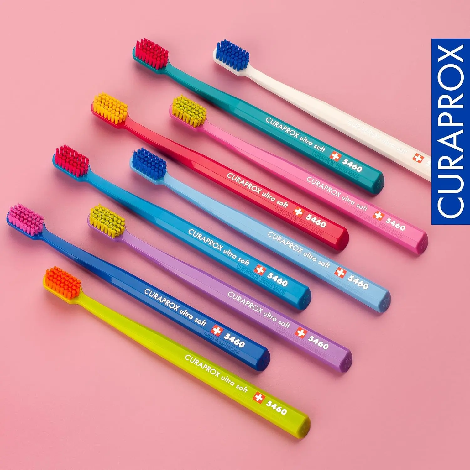 This image shows a six-pack of Curaprox CS 5460 ultra-soft toothbrushes with densely packed CUREN bristles for gentle and effective plaque removal and gum line cleaning.