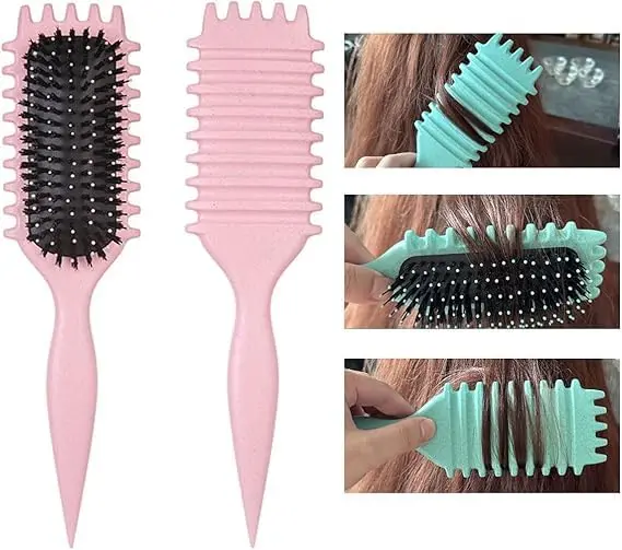 This pink curl defining brush is designed with an ergonomic handle and special bristles to easily detangle, shape, and style curly hair, restoring natural shine and reducing frizz.