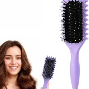 A purple curl defining brush with an ergonomic handle and open vent design, suitable for detangling, combing, shaping, and styling all types of curly hair.